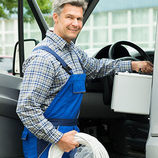 Inszone Insurance Commercial Package (Bundle all Lines) Page Banner - Delivery Man Holding a Package While Standing