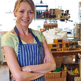 Business Woman Standing - Lead Image for Convenience Stores Page