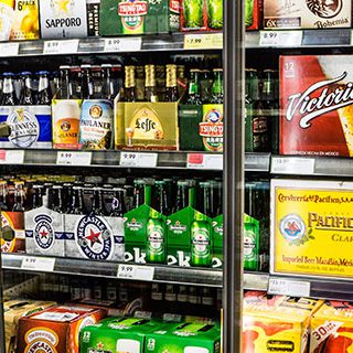Various Alcoholic Drinks Displayed on Shelf - Lead Image for Liquor Stores Page