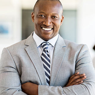 Inszone Insurance Management & Professional Liability Insurance (E&O) Page Banner - Business Man Smiling