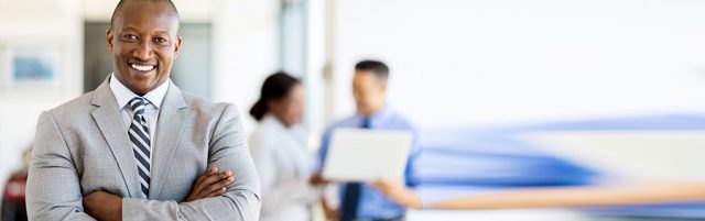 Inszone Insurance Management & Professional Liability Insurance (E&O) Page Banner - Business Man Smiling