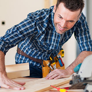 Inszone Insurance Workers Compensation Insurance Page Banner - Male Construction Worker Using Construction Tools