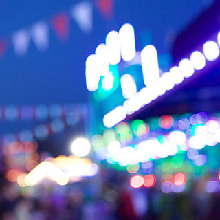 Blurry Amusement Park Image at Night - Lead Image for Fairs and Carnivals Page