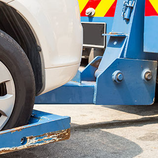 Tow Truck Towing a Vehicle - Lead Image for Tow Services Page