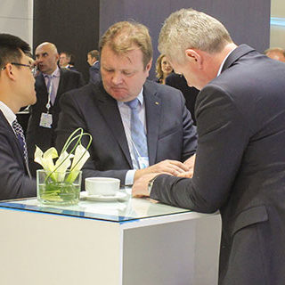 Corporate Men Talking at Conference - Lead Image for Trade Shows Page